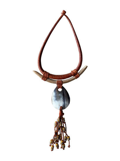 Powerful designer necklace with horn pendant and natural materials