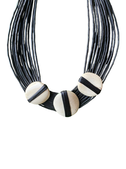 "Natural Statement" necklace made from treated cow bone and dyed goatskin